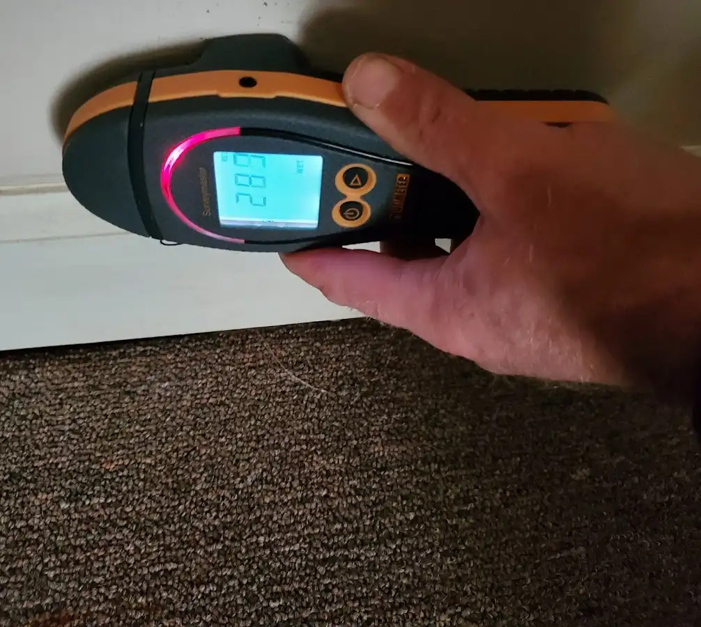 Moisture detection at baseboard during Storm Damage Restoration in Jamestown